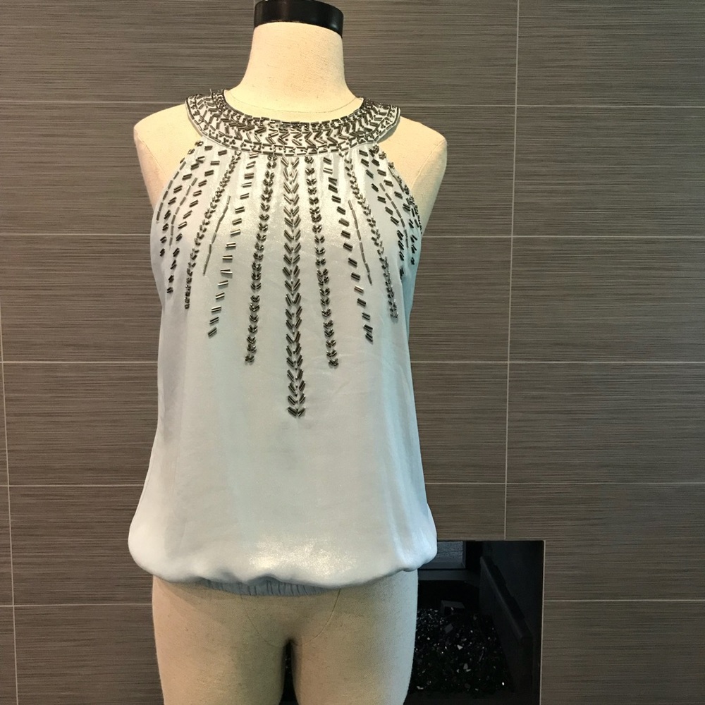 Light blue, delicate, beaded top.